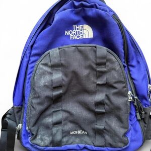 NORTH FACE Mohican backpack. Black/purple with orange accent inside.